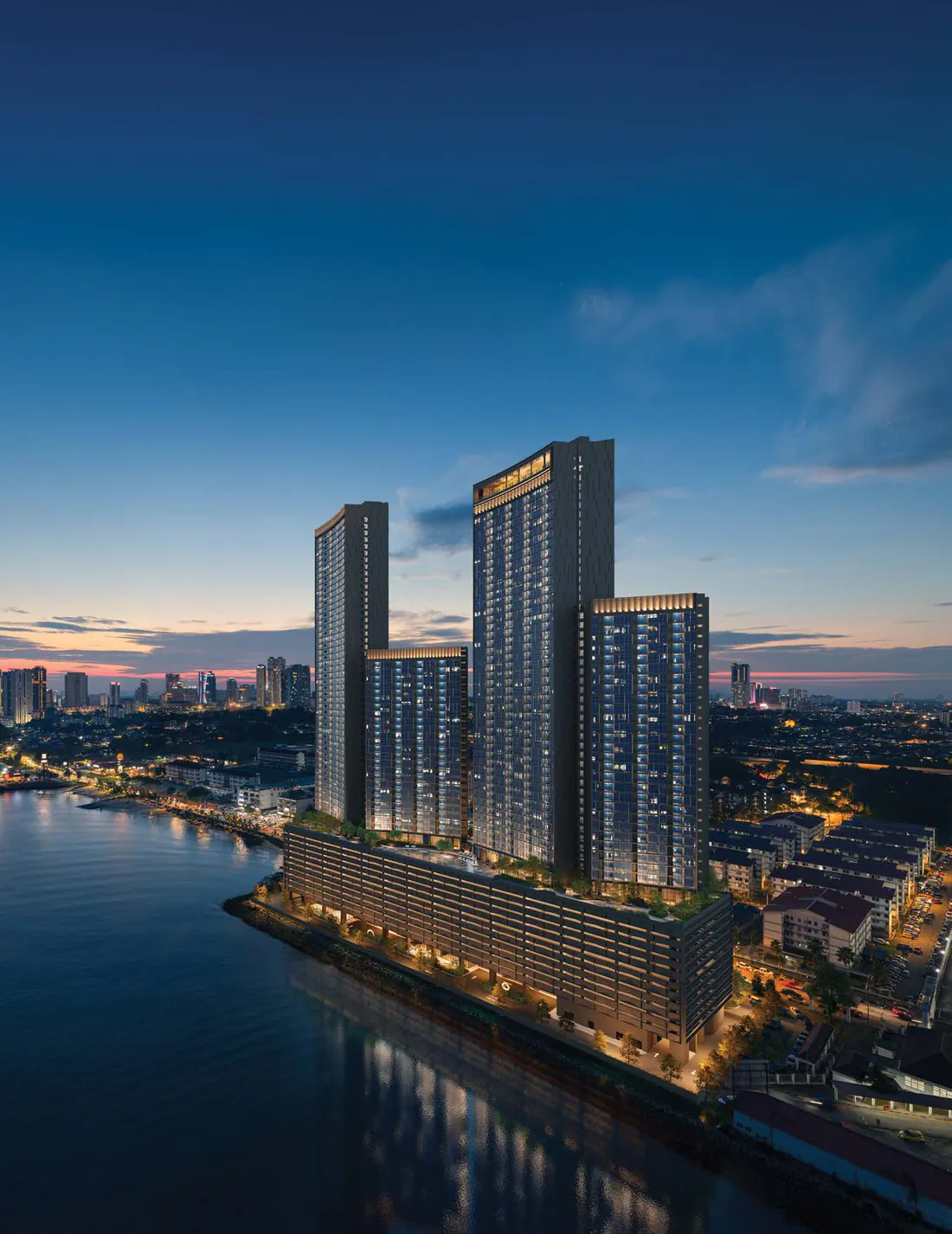 The shore of the Straits of Johor at dusk, with the four curved crowns of The Eclipse lit up (photomontage; the proposed towers are CGI)